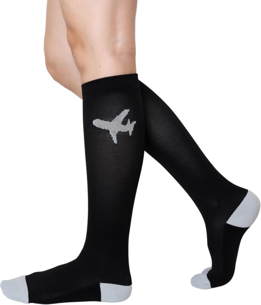 Compression socks for men and women, offering 20-30 mmHg graduated compression. Designed for comfort during flights, travel, sports, pregnancy, or running, these black socks provide support and help reduce swelling.
