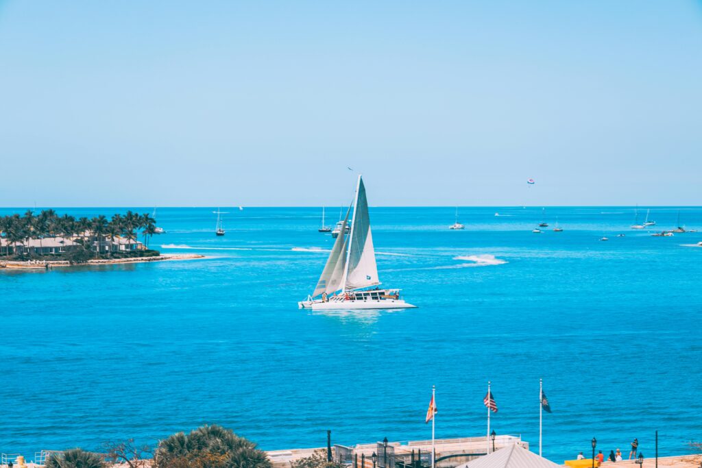 A picturesque sailboat gliding through the turquoise waters of Key West, Florida.