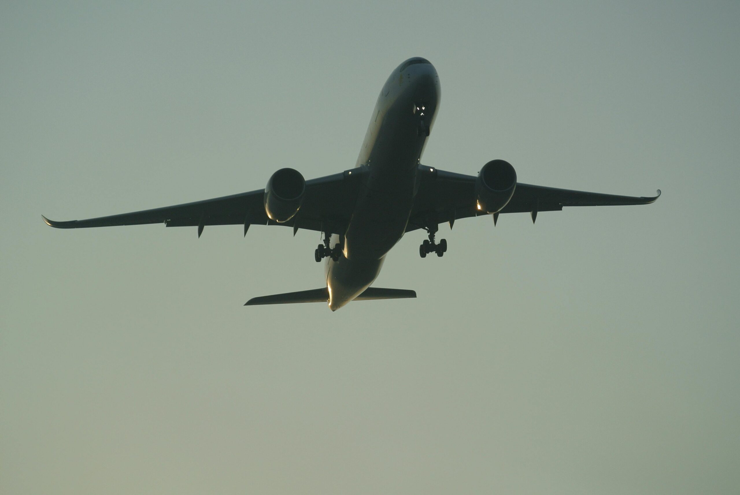 flying commercial airplane in a dark sky